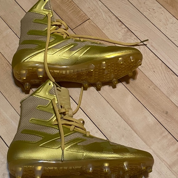 Under Armour gold cleats size 9.5
